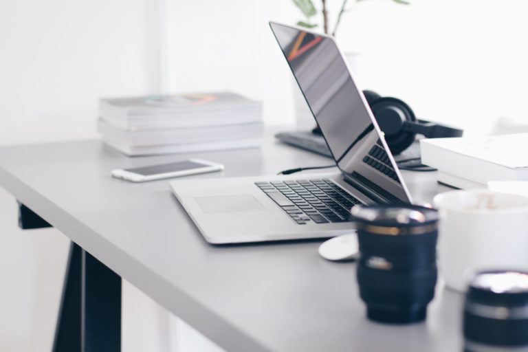a laptop and a cup of coffee