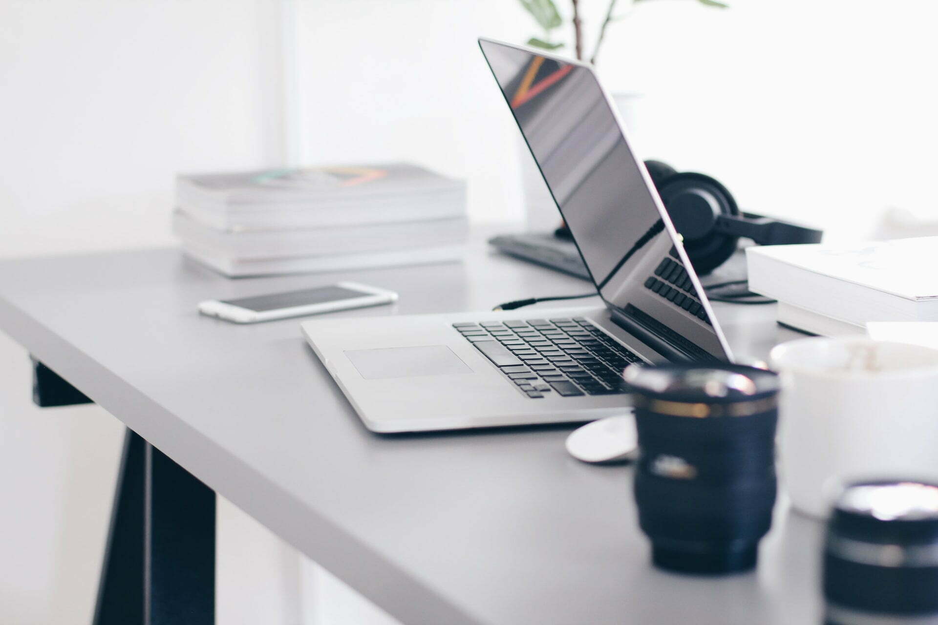 a laptop and a cup of coffee