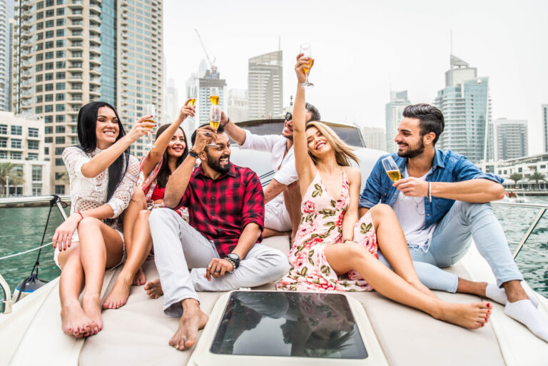 Group of friends celebrating on a luxury yacht, travel inspiration and lifestyle.