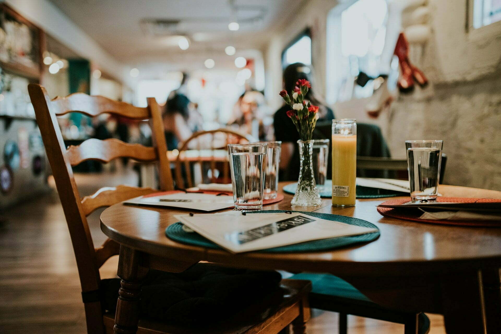 a table with glasses and a menu