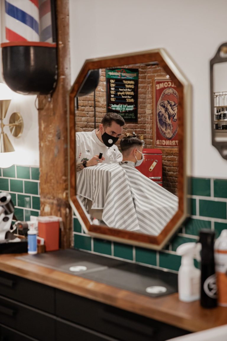 a person taking a picture of himself in a mirror