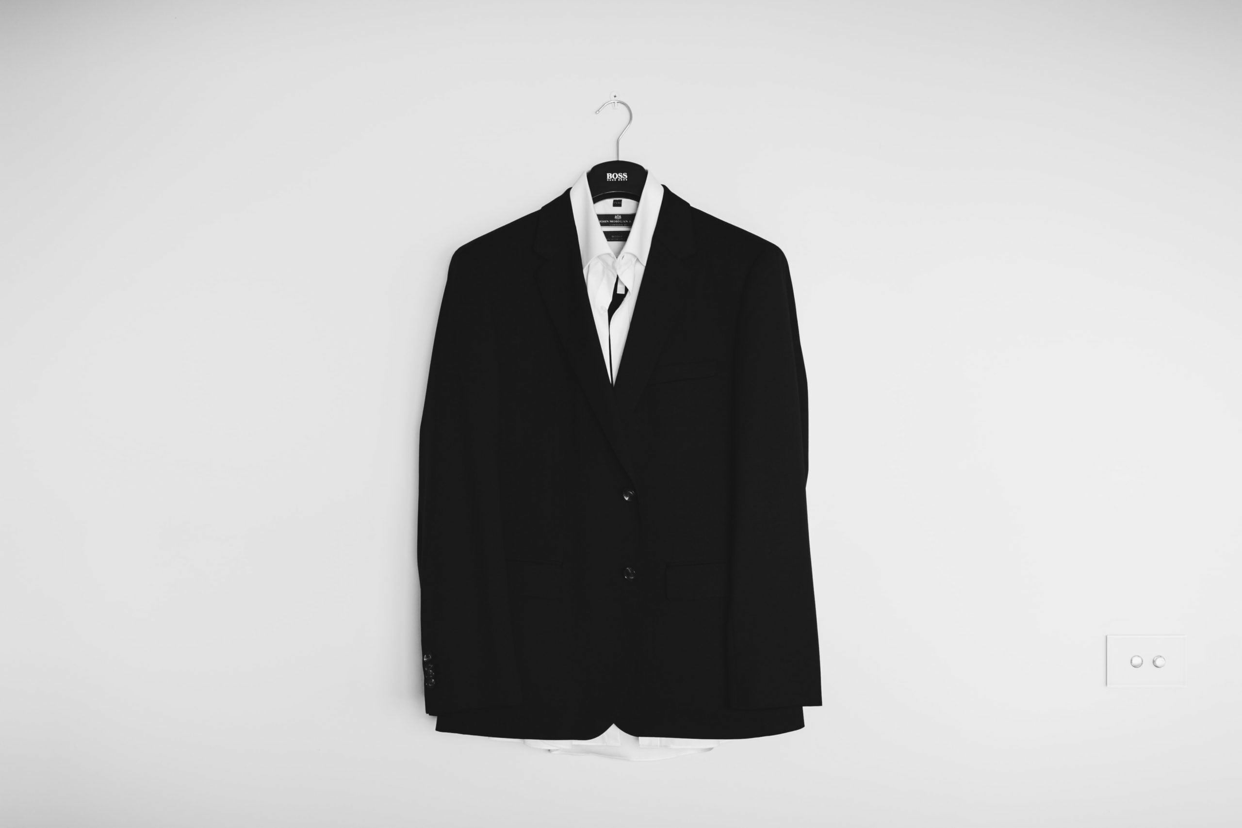 a black shirt with a white tie